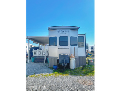 Adorable, newer camper with fabulous attached covered porch. 1 on North Shore Country Club in North Carolina - for sale on GolfHomes.com, golf home, golf lot