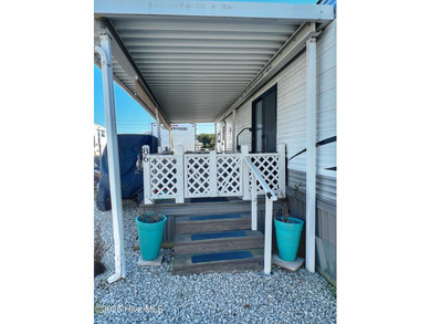 Adorable, newer camper with fabulous attached covered porch. 1 on North Shore Country Club in North Carolina - for sale on GolfHomes.com, golf home, golf lot