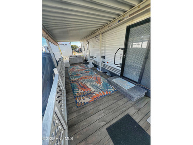 Adorable, newer camper with fabulous attached covered porch. 1 on North Shore Country Club in North Carolina - for sale on GolfHomes.com, golf home, golf lot