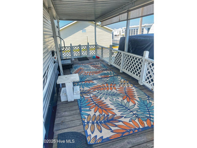 Adorable, newer camper with fabulous attached covered porch. 1 on North Shore Country Club in North Carolina - for sale on GolfHomes.com, golf home, golf lot