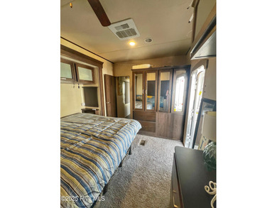 Adorable, newer camper with fabulous attached covered porch. 1 on North Shore Country Club in North Carolina - for sale on GolfHomes.com, golf home, golf lot