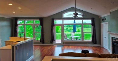 Experience luxury and privacy in this stunning Rhodes-built home on The Golf Club At Yankee Trace in Ohio - for sale on GolfHomes.com, golf home, golf lot