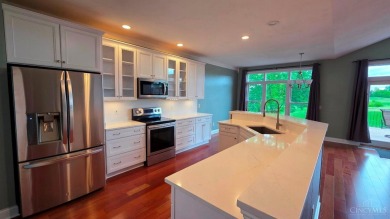 Experience luxury and privacy in this stunning Rhodes-built home on The Golf Club At Yankee Trace in Ohio - for sale on GolfHomes.com, golf home, golf lot