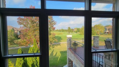 Experience luxury and privacy in this stunning Rhodes-built home on The Golf Club At Yankee Trace in Ohio - for sale on GolfHomes.com, golf home, golf lot