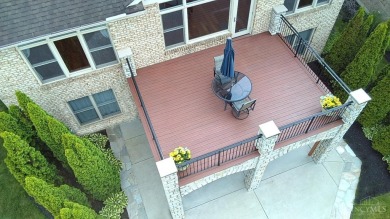 Experience luxury and privacy in this stunning Rhodes-built home on The Golf Club At Yankee Trace in Ohio - for sale on GolfHomes.com, golf home, golf lot