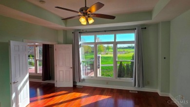 Experience luxury and privacy in this stunning Rhodes-built home on The Golf Club At Yankee Trace in Ohio - for sale on GolfHomes.com, golf home, golf lot