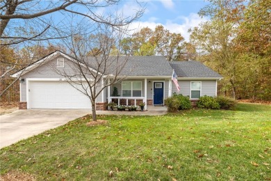 A charming 3-bedroom, 2-bath home on a relatively flat and on Bella Vista Country Club - Highlands in Arkansas - for sale on GolfHomes.com, golf home, golf lot