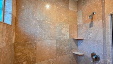 Experience luxury and privacy in this stunning Rhodes-built home on The Golf Club At Yankee Trace in Ohio - for sale on GolfHomes.com, golf home, golf lot