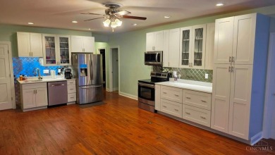 Experience luxury and privacy in this stunning Rhodes-built home on The Golf Club At Yankee Trace in Ohio - for sale on GolfHomes.com, golf home, golf lot