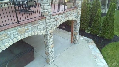 Experience luxury and privacy in this stunning Rhodes-built home on The Golf Club At Yankee Trace in Ohio - for sale on GolfHomes.com, golf home, golf lot