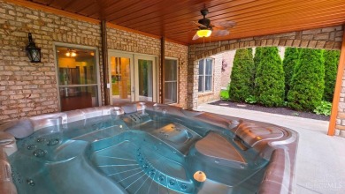 Experience luxury and privacy in this stunning Rhodes-built home on The Golf Club At Yankee Trace in Ohio - for sale on GolfHomes.com, golf home, golf lot