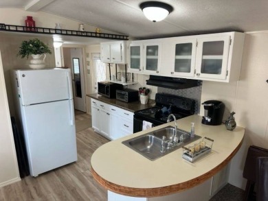 Charming Turnkey Home on a Perimeter Lot!    This home is in on Lake Henry Golf Club in Florida - for sale on GolfHomes.com, golf home, golf lot