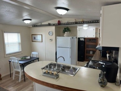 Charming Turnkey Home on a Perimeter Lot!    This home is in on Lake Henry Golf Club in Florida - for sale on GolfHomes.com, golf home, golf lot