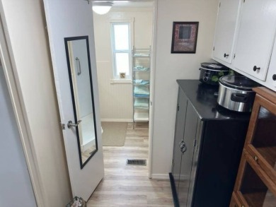 Charming Turnkey Home on a Perimeter Lot!    This home is in on Lake Henry Golf Club in Florida - for sale on GolfHomes.com, golf home, golf lot