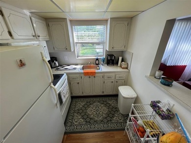 Come see it now! Corner 2nd floor 1 br/1.5 bth with CENTRAL A/C on Hillsboro Pines Golf in Florida - for sale on GolfHomes.com, golf home, golf lot