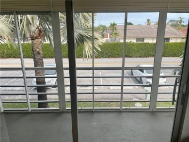Come see it now! Corner 2nd floor 1 br/1.5 bth with CENTRAL A/C on Hillsboro Pines Golf in Florida - for sale on GolfHomes.com, golf home, golf lot