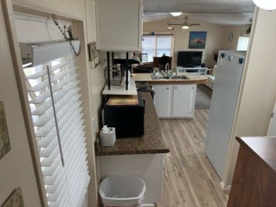 Charming Turnkey Home on a Perimeter Lot!    This home is in on Lake Henry Golf Club in Florida - for sale on GolfHomes.com, golf home, golf lot