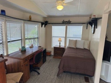 Charming Turnkey Home on a Perimeter Lot!    This home is in on Lake Henry Golf Club in Florida - for sale on GolfHomes.com, golf home, golf lot