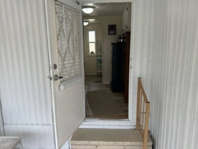 Charming Turnkey Home on a Perimeter Lot!    This home is in on Lake Henry Golf Club in Florida - for sale on GolfHomes.com, golf home, golf lot