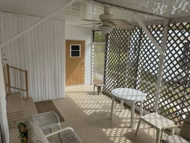 Charming Turnkey Home on a Perimeter Lot!    This home is in on Lake Henry Golf Club in Florida - for sale on GolfHomes.com, golf home, golf lot