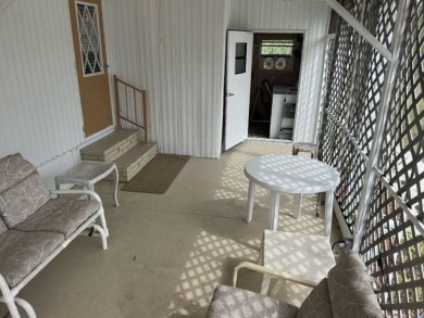Charming Turnkey Home on a Perimeter Lot!    This home is in on Lake Henry Golf Club in Florida - for sale on GolfHomes.com, golf home, golf lot