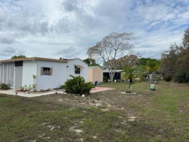 Charming Turnkey Home on a Perimeter Lot!    This home is in on Lake Henry Golf Club in Florida - for sale on GolfHomes.com, golf home, golf lot