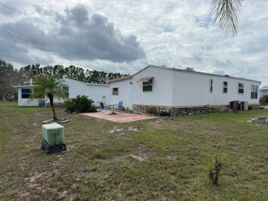 Charming Turnkey Home on a Perimeter Lot!    This home is in on Lake Henry Golf Club in Florida - for sale on GolfHomes.com, golf home, golf lot