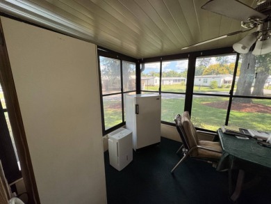 There is tons of space inside & out in this 2/2 sanctuary! It is on Lake Henry Golf Club in Florida - for sale on GolfHomes.com, golf home, golf lot