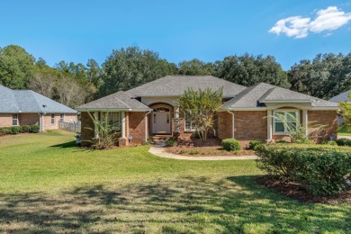 This beautifully landscaped 4-bedroom, 3-bath is an all-brick on The Golf Club At Summerbrooke in Florida - for sale on GolfHomes.com, golf home, golf lot