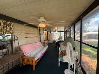 There is tons of space inside & out in this 2/2 sanctuary! It is on Lake Henry Golf Club in Florida - for sale on GolfHomes.com, golf home, golf lot