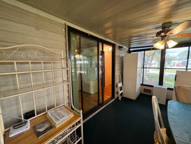 There is tons of space inside & out in this 2/2 sanctuary! It is on Lake Henry Golf Club in Florida - for sale on GolfHomes.com, golf home, golf lot