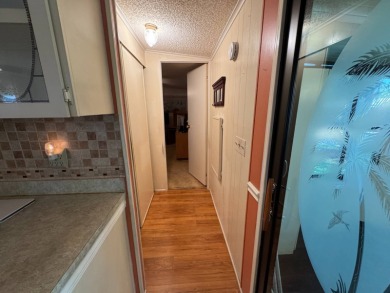 There is tons of space inside & out in this 2/2 sanctuary! It is on Lake Henry Golf Club in Florida - for sale on GolfHomes.com, golf home, golf lot