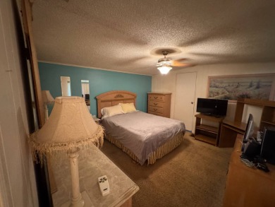 There is tons of space inside & out in this 2/2 sanctuary! It is on Lake Henry Golf Club in Florida - for sale on GolfHomes.com, golf home, golf lot