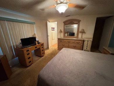 There is tons of space inside & out in this 2/2 sanctuary! It is on Lake Henry Golf Club in Florida - for sale on GolfHomes.com, golf home, golf lot