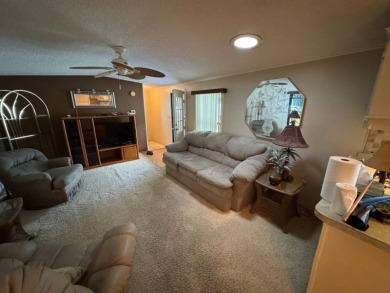 There is tons of space inside & out in this 2/2 sanctuary! It is on Lake Henry Golf Club in Florida - for sale on GolfHomes.com, golf home, golf lot