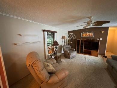 There is tons of space inside & out in this 2/2 sanctuary! It is on Lake Henry Golf Club in Florida - for sale on GolfHomes.com, golf home, golf lot