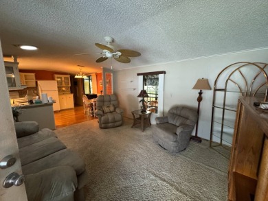There is tons of space inside & out in this 2/2 sanctuary! It is on Lake Henry Golf Club in Florida - for sale on GolfHomes.com, golf home, golf lot