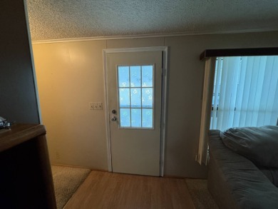 There is tons of space inside & out in this 2/2 sanctuary! It is on Lake Henry Golf Club in Florida - for sale on GolfHomes.com, golf home, golf lot
