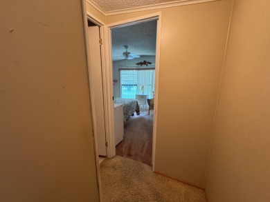 There is tons of space inside & out in this 2/2 sanctuary! It is on Lake Henry Golf Club in Florida - for sale on GolfHomes.com, golf home, golf lot