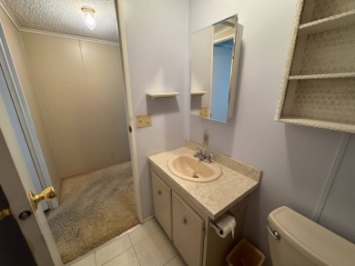 There is tons of space inside & out in this 2/2 sanctuary! It is on Lake Henry Golf Club in Florida - for sale on GolfHomes.com, golf home, golf lot