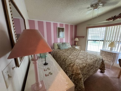 There is tons of space inside & out in this 2/2 sanctuary! It is on Lake Henry Golf Club in Florida - for sale on GolfHomes.com, golf home, golf lot