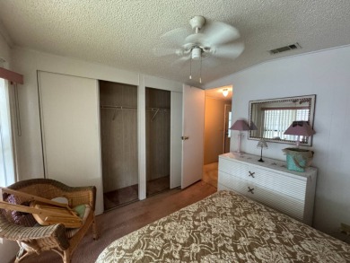 There is tons of space inside & out in this 2/2 sanctuary! It is on Lake Henry Golf Club in Florida - for sale on GolfHomes.com, golf home, golf lot