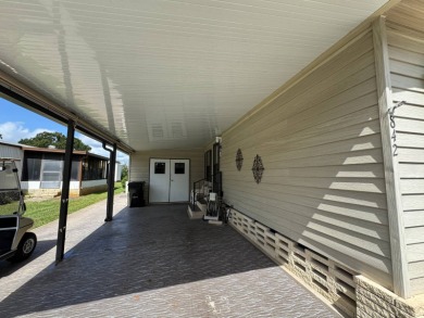 There is tons of space inside & out in this 2/2 sanctuary! It is on Lake Henry Golf Club in Florida - for sale on GolfHomes.com, golf home, golf lot