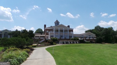 THIS BEAUTIFUL 1.5 STORY STUCCO HOME BEHIND THE GATES OF THE on Eagles Landing Country Club in Georgia - for sale on GolfHomes.com, golf home, golf lot