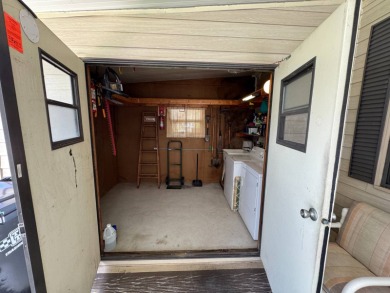 There is tons of space inside & out in this 2/2 sanctuary! It is on Lake Henry Golf Club in Florida - for sale on GolfHomes.com, golf home, golf lot