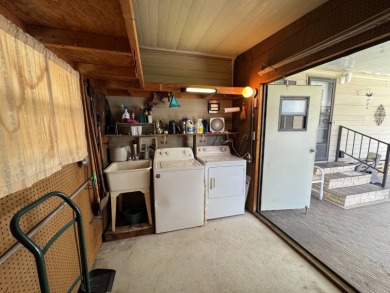 There is tons of space inside & out in this 2/2 sanctuary! It is on Lake Henry Golf Club in Florida - for sale on GolfHomes.com, golf home, golf lot