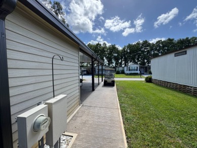 There is tons of space inside & out in this 2/2 sanctuary! It is on Lake Henry Golf Club in Florida - for sale on GolfHomes.com, golf home, golf lot