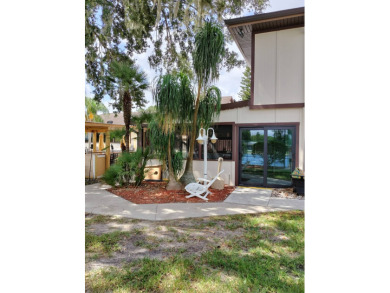 There is tons of space inside & out in this 2/2 sanctuary! It is on Lake Henry Golf Club in Florida - for sale on GolfHomes.com, golf home, golf lot