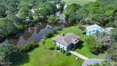 Nestled in Skimmer Cove on Blue Heron Lake, this home offers one on Ocean Point Golf Links in South Carolina - for sale on GolfHomes.com, golf home, golf lot