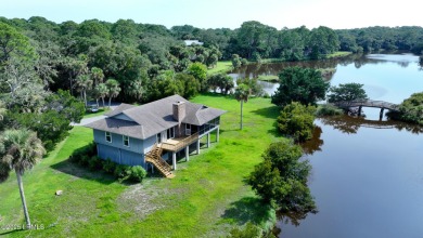 Nestled in Skimmer Cove on Blue Heron Lake, this home offers one on Ocean Point Golf Links in South Carolina - for sale on GolfHomes.com, golf home, golf lot